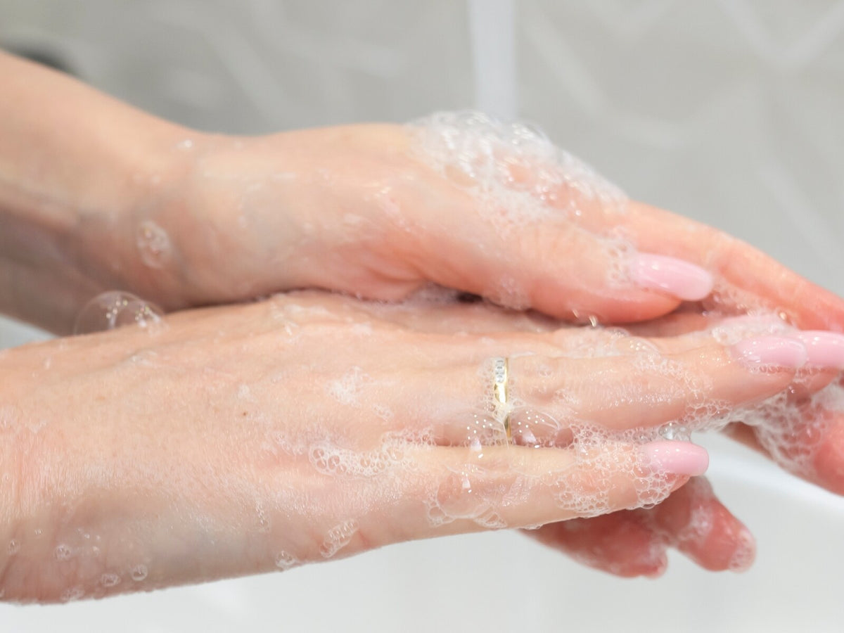 Hands being washed under running water